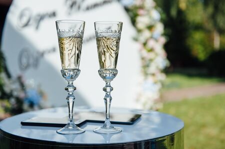 A row of empty champagne glasses on table. Banquet settingの写真素材