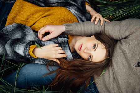 Gorgeous girl lies on her boyfriend lap.の写真素材