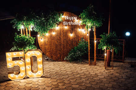 Round wooden arch, photo zone for a photo shoot for a 50th anniversary manの写真素材