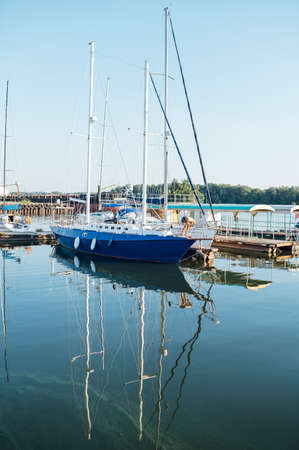 Row of yachts anchored in harbour of a European cityの写真素材