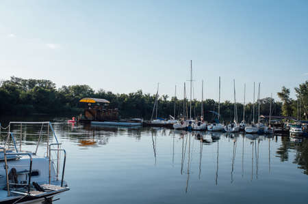 Row of yachts anchored in harbour of a European cityの写真素材