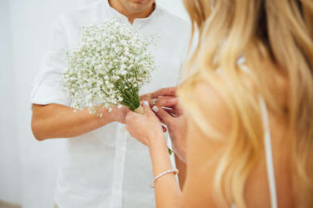 Hands of the bride and groom. Bride and groom holding hands at a wedding ceremony.の写真素材