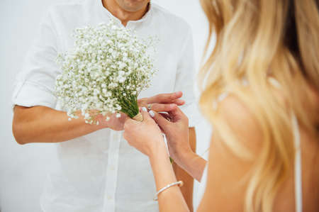 Hands of the bride and groom. Bride and groom holding hands at a wedding ceremony.の写真素材