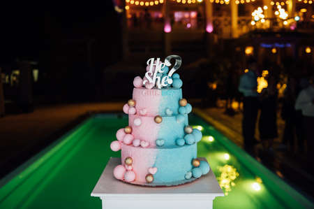 Big and delicious pink and blue baby gender reveal party cakeの写真素材