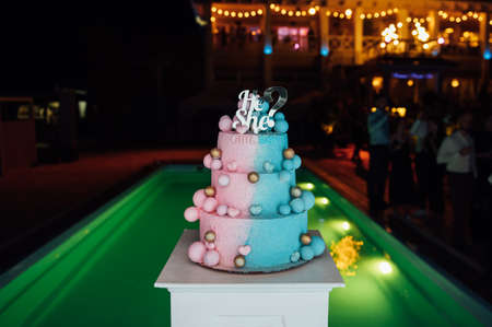 Big and delicious pink and blue baby gender reveal party cakeの写真素材