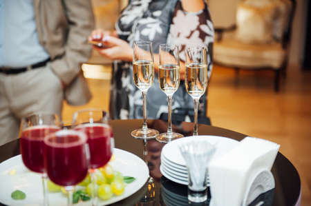 Glasses of champagne at the Banquet, white sparkling wine in wine glasses, festive moodの写真素材
