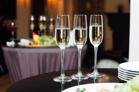 Glasses of champagne at the Banquet, white sparkling wine in wine glasses, festive moodの写真素材