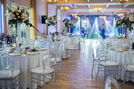 A beautiful vase of flowers on a table in a luxury restaurant. Wedding decorationsの写真素材