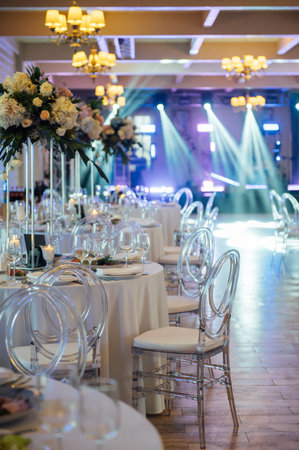 A beautiful vase of flowers on a table in a luxury restaurant. Wedding decorationsの写真素材