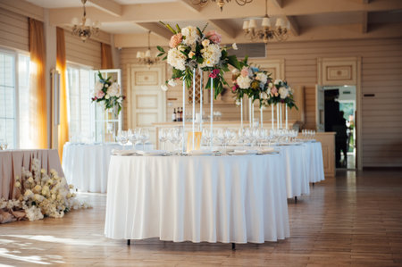 A beautiful vase of flowers on a table in a luxury restaurant. Wedding decorationsの写真素材