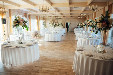 A beautiful vase of flowers on a table in a luxury restaurant. Wedding decorationsの写真素材