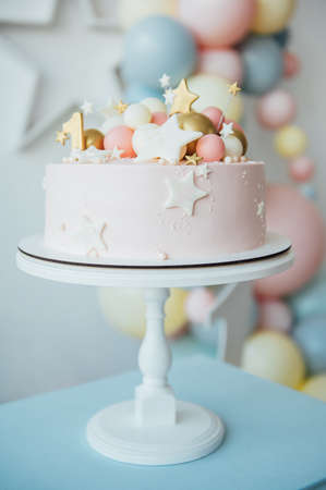 Colorful decoration of a first year birthday cakeの写真素材