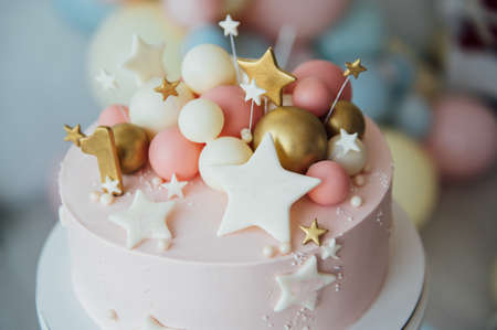 Colorful decoration of a first year birthday cakeの写真素材