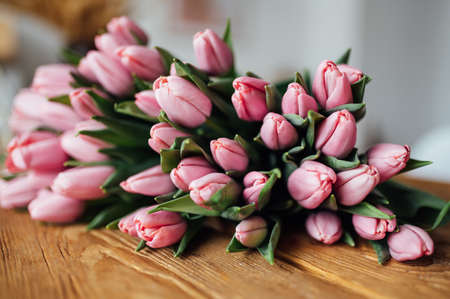 bouquet of tulips on wood table. Border designの写真素材
