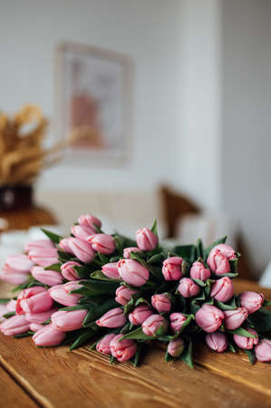 bouquet of tulips on wood table. Border designの写真素材