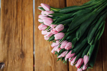 bouquet of tulips on wood table. Border designの写真素材