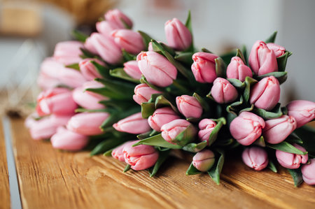 bouquet of tulips on wood table. Border designの写真素材