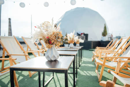 view of cozy cafe outdoors on the roofの写真素材