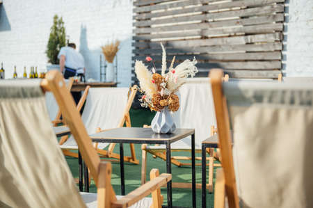 view of cozy cafe outdoors on the roofの写真素材