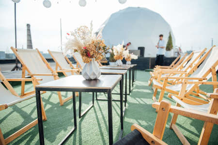 view of cozy cafe outdoors on the roofの写真素材