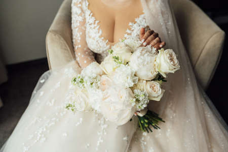 Beautiful wedding bouquet in hands of the brideの写真素材