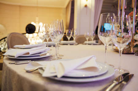 Banquet decorated table, with cutlery. Wedding decor in the banquet hall.の写真素材