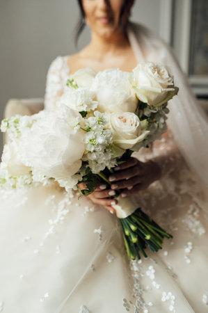 Beautiful wedding bouquet in hands of the brideの写真素材