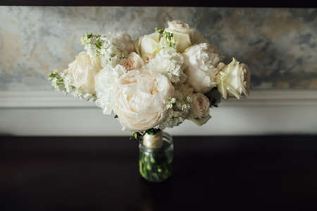 beautiful modern wedding bouquet on black tableの写真素材