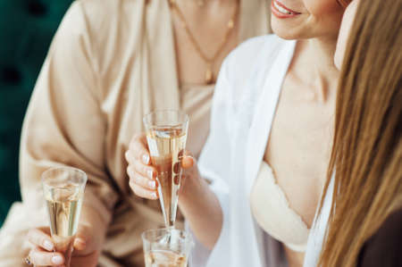 Young people in club or bar drinking cocktails and having funの写真素材