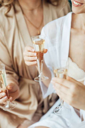 Young people in club or bar drinking cocktails and having funの写真素材