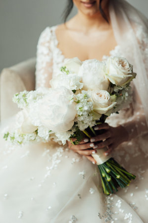 Beautiful wedding bouquet in hands of the brideの写真素材