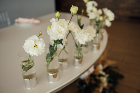 Luxurious restaurant. Luxurious interior, white tables, serving dishes and glasses for guestsの写真素材