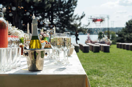 Wine glass background. Alcohol banquet table. Shiny alcohol empty glasses.の写真素材