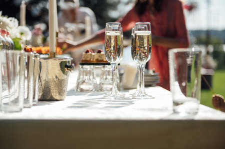 Wine glass background. Alcohol banquet table. Shiny alcohol empty glasses.の写真素材