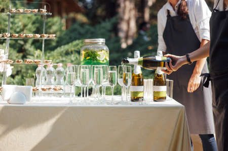 Wine glass background. Alcohol banquet table. Shiny alcohol empty glasses.の写真素材