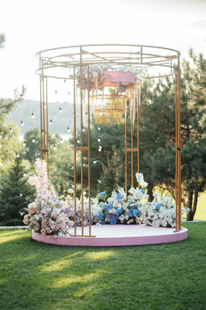 Trendy arch for a wedding ceremony with soft puffs for guestsの写真素材