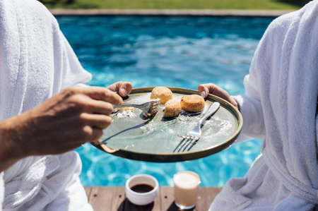 Couple having breakfast in luxury resort. Sunny dayの写真素材