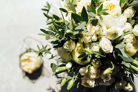 Bridal bouquet and wedding rings on windowの写真素材