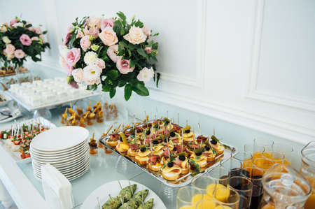 A wide variety of snacks on the table for guests. Shrimp, boiled pork, various types of meat and other productsの写真素材