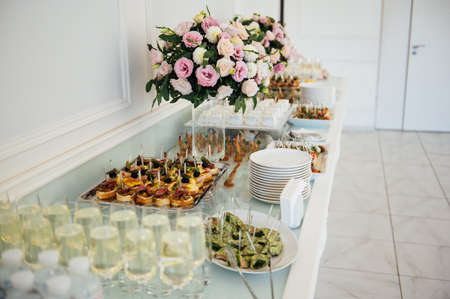 A wide variety of snacks on the table for guests. Shrimp, boiled pork, various types of meat and other productsの写真素材