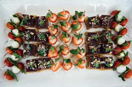 A wide variety of snacks on the table for guests. Shrimp, boiled pork, various types of meat and...