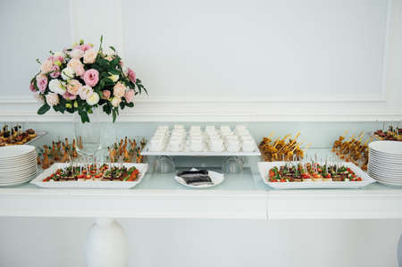 A wide variety of snacks on the table for guests. Shrimp, boiled pork, various types of meat and other productsの写真素材