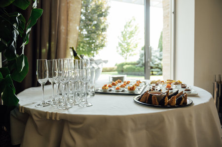 A wide variety of snacks on the table for guests. Shrimp, boiled pork, various types of meat and...