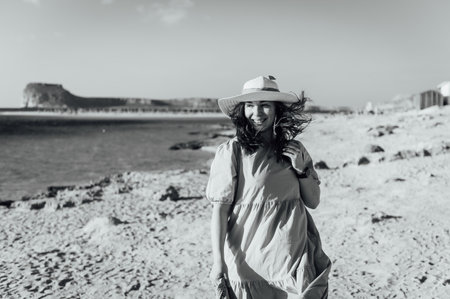 Beautiful sexy girl walks and poses for a photo on the island of Crete near Balos bayの写真素材