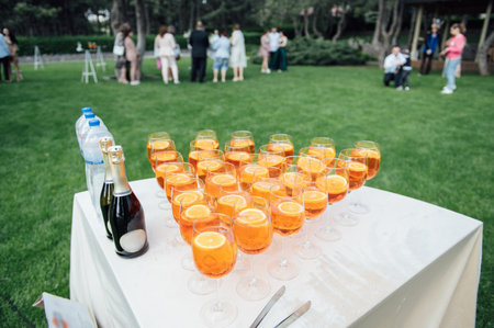 A lot of glasses with apple and orange juice on the buffet tableの写真素材