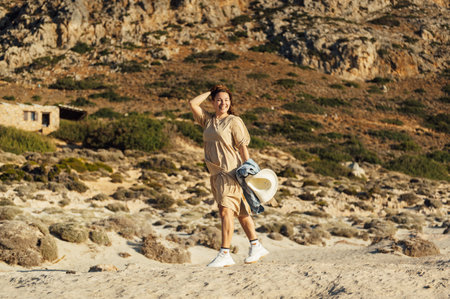 Beautiful sexy girl walks and poses for a photo on the island of Crete near Balos bayの写真素材