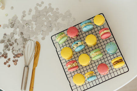 traditional french colorful macarons in a rows on a metal meshの写真素材