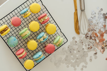 traditional french colorful macarons in a rows on a metal meshの写真素材