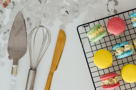 traditional french colorful macarons in a rows on a metal meshの写真素材