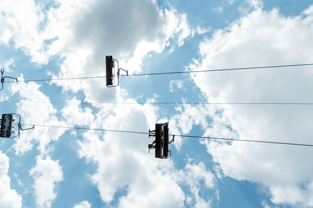 Mountain four-seater chairlift on the background of a blue cloud sky.の写真素材